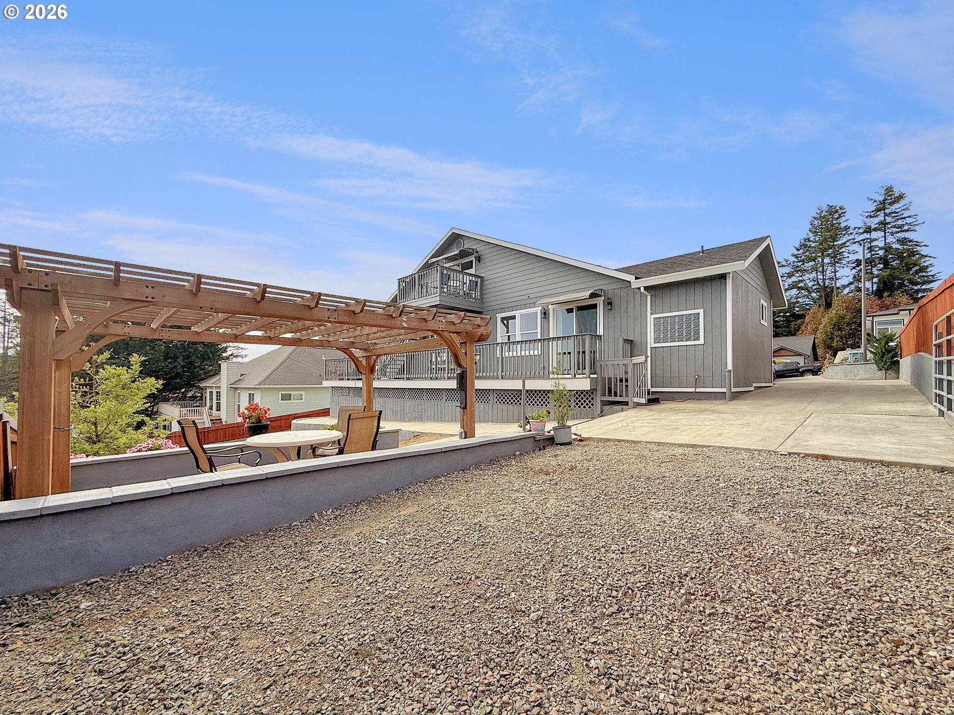 7175 Vista Ridge Drive Brookings, OR 97415 - Photo 33 of 43 a front view of a house with a yard and garage