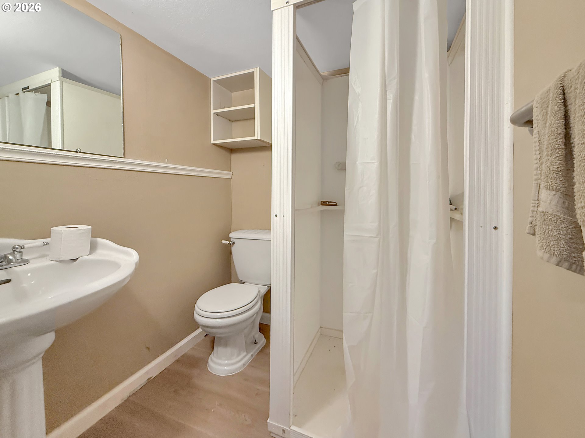 7175 Vista Ridge Drive Brookings, OR 97415 - Photo 40 of 43 a white toilet sitting next to a bathroom sink