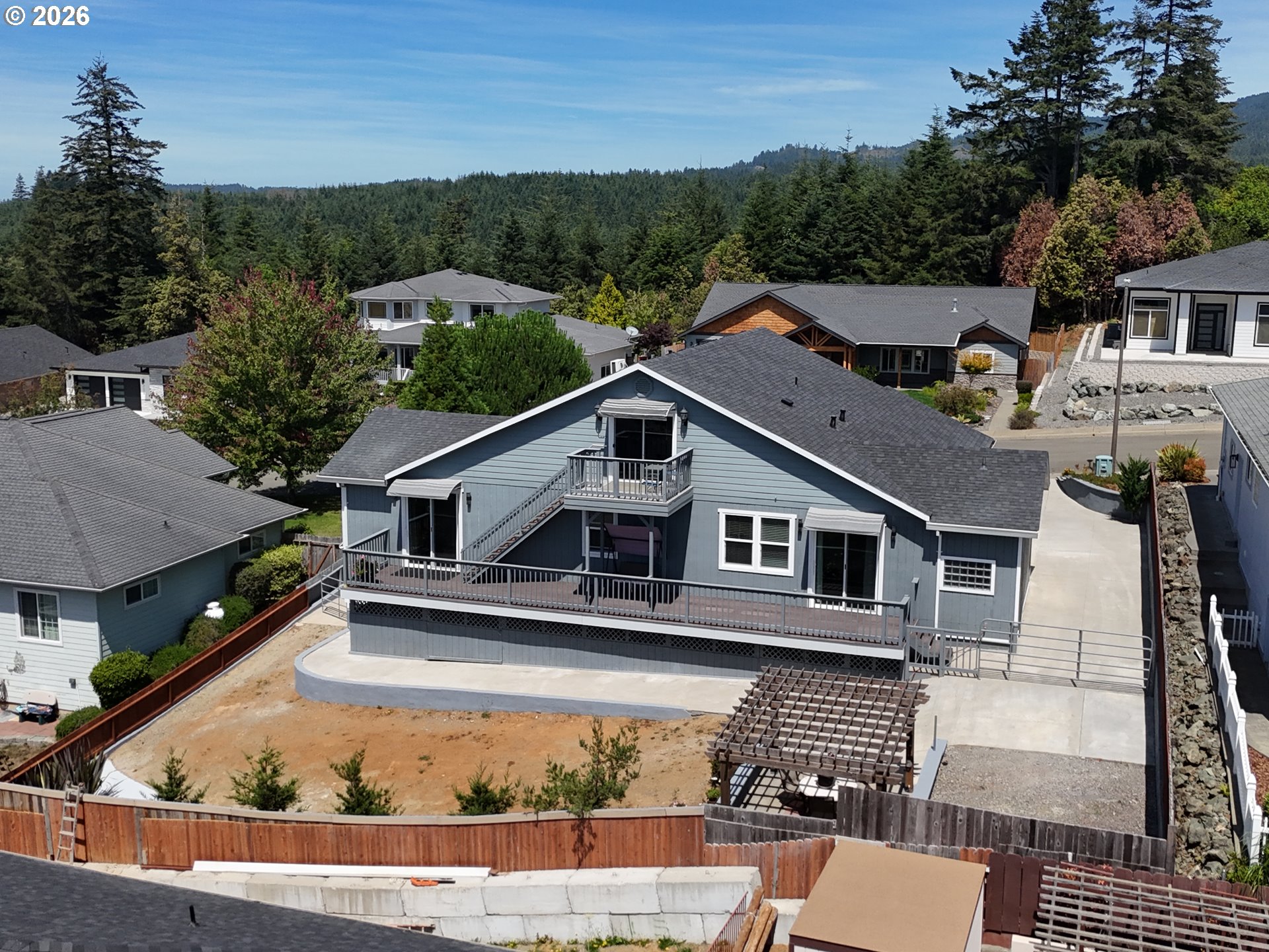 7175 Vista Ridge Drive Brookings, OR 97415 - Photo 42 of 43 an aerial view of a house with a yard