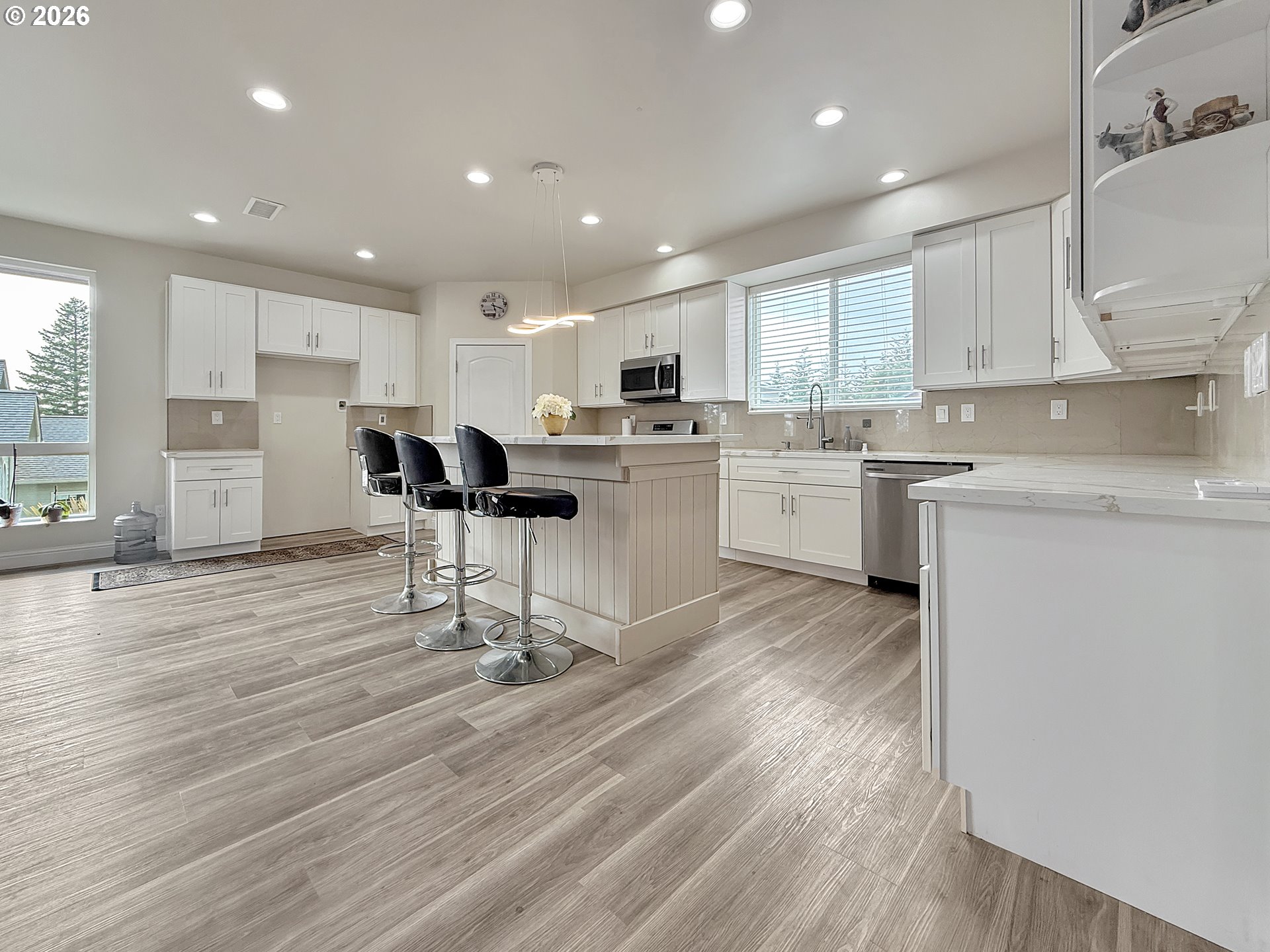 7175 Vista Ridge Drive Brookings, OR 97415 - Photo 6 of 43 a kitchen with a sink a window and chairs