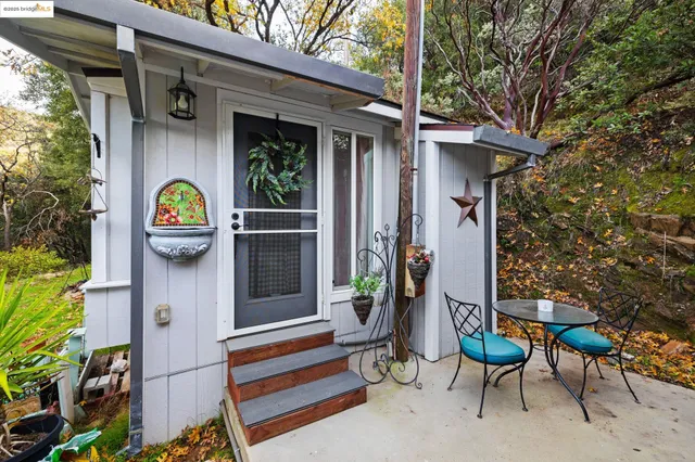 a bedroom with furniture and a large window