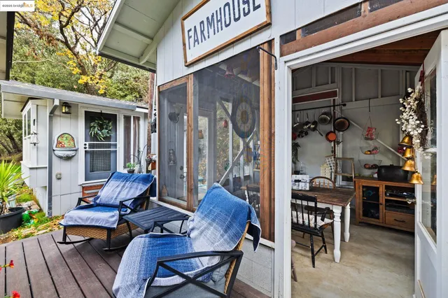 a kitchen with stainless steel appliances granite countertop a sink a stove and a wooden floors