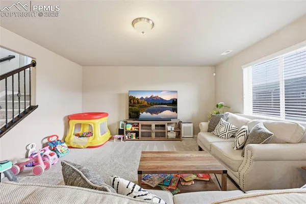 a living room with furniture and a couch