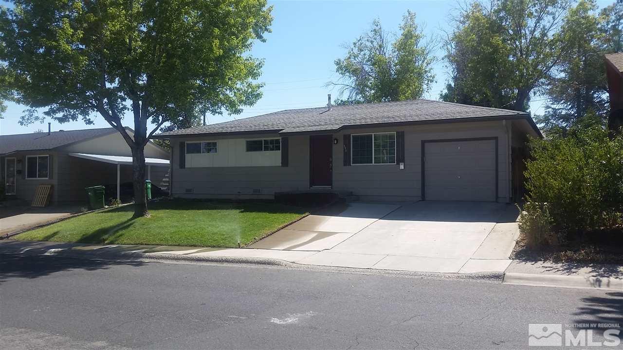 945 Beldon Way Reno, NV 89503 - Photo 1 of 20 a backyard of a house with green space