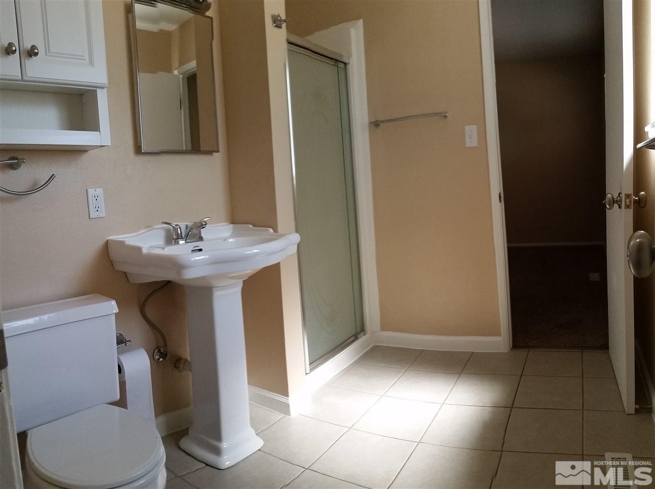 945 Beldon Way Reno, NV 89503 - Photo 11 of 20 a bathroom with a sink toilet and shower