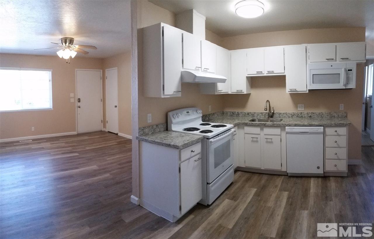 945 Beldon Way Reno, NV 89503 - Photo 5 of 20 a kitchen with a sink window and cabinets