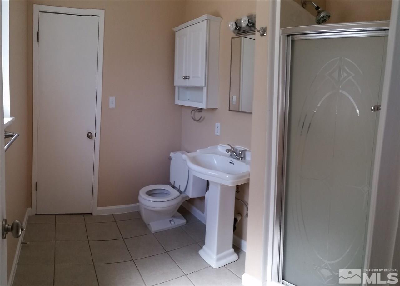 945 Beldon Way Reno, NV 89503 - Photo 10 of 20 a bathroom with a sink toilet and shower