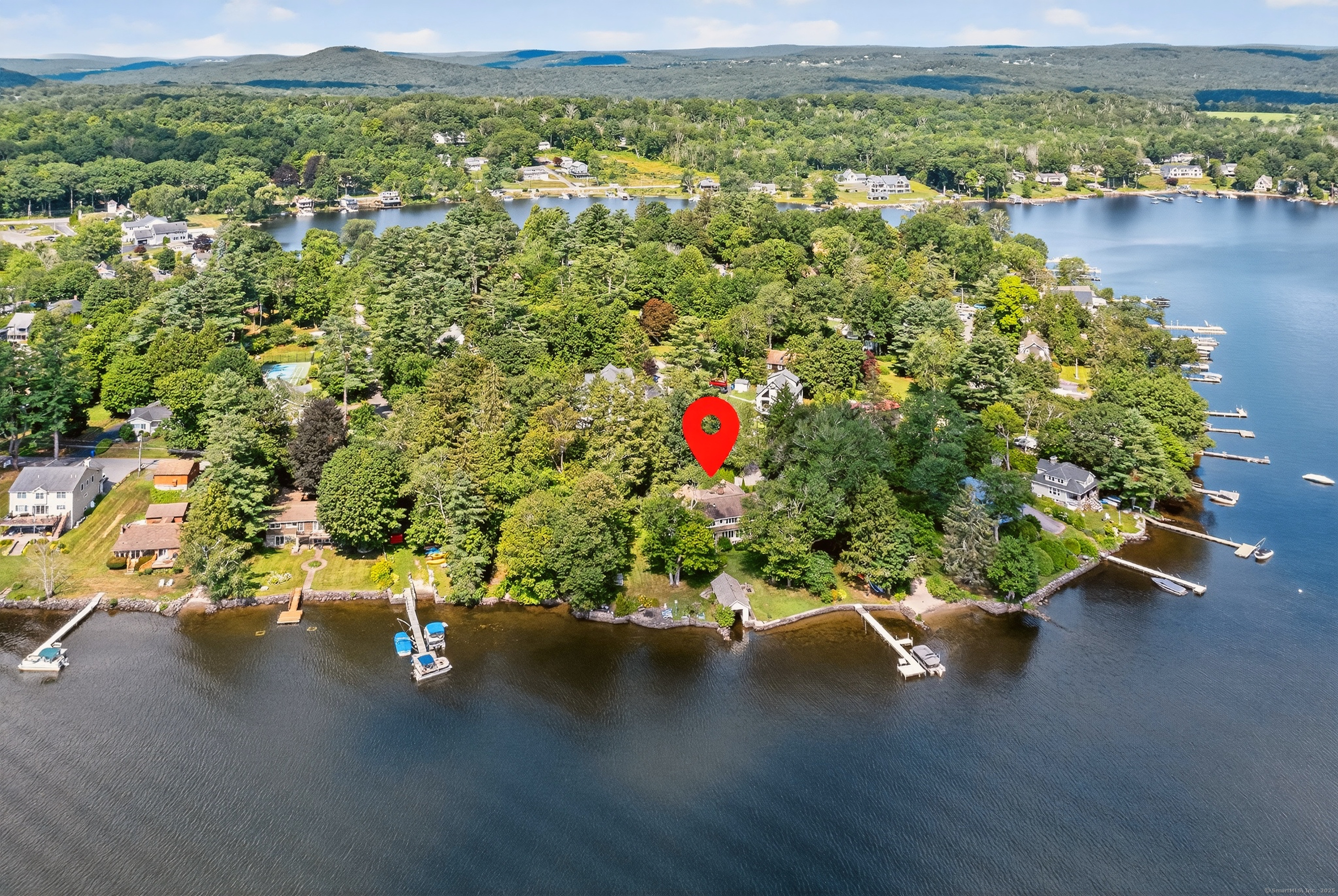 98 Island Trail Morris, CT 06763 - Photo 1 of 36 an aerial view of a houses with a lake view