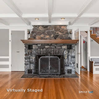 98 Island Trail Morris, CT 06763 - Photo 15 of 36 a living room with a fireplace and a wooden floor