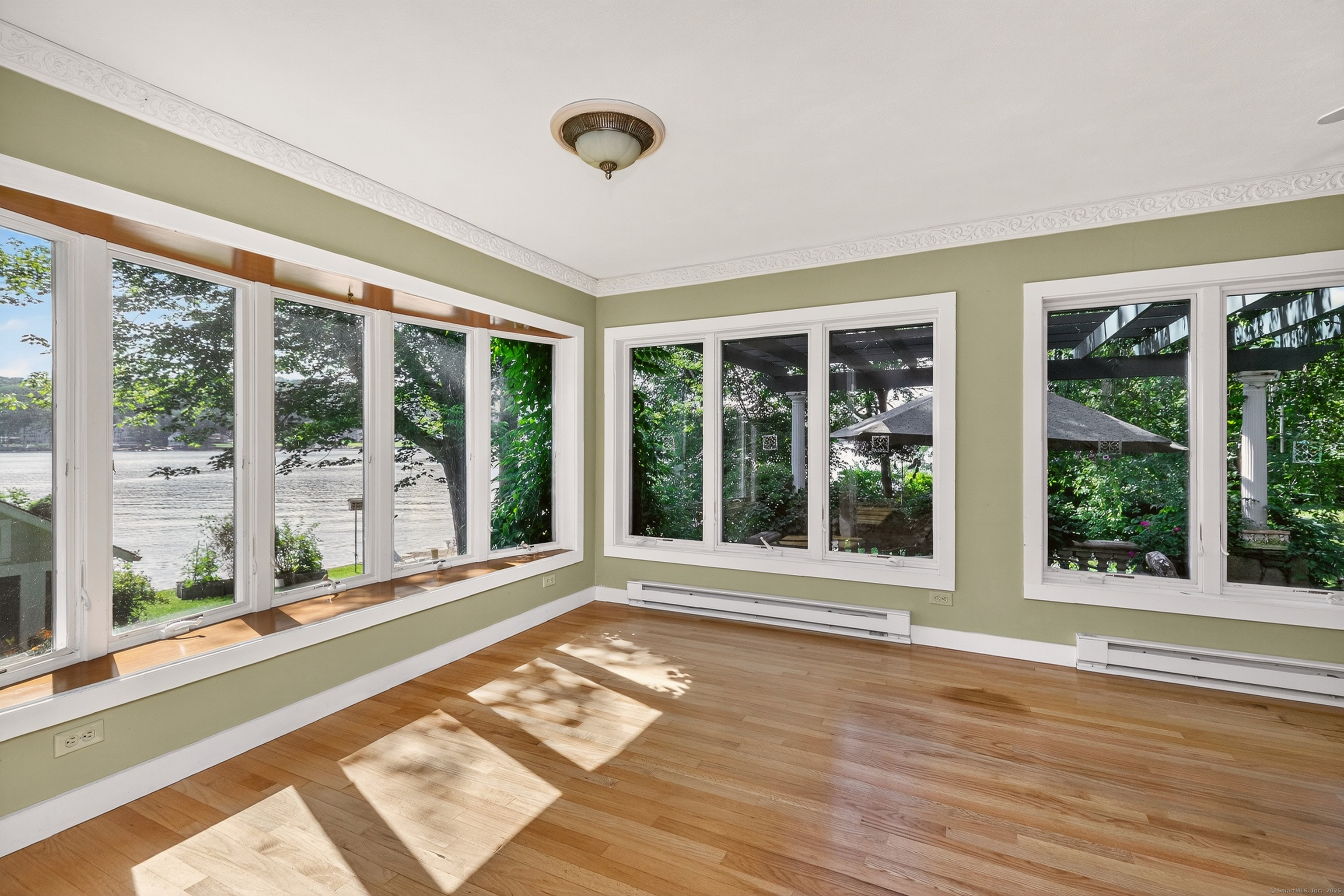 98 Island Trail Morris, CT 06763 - Photo 19 of 36 a view of a room with wooden floor and windows