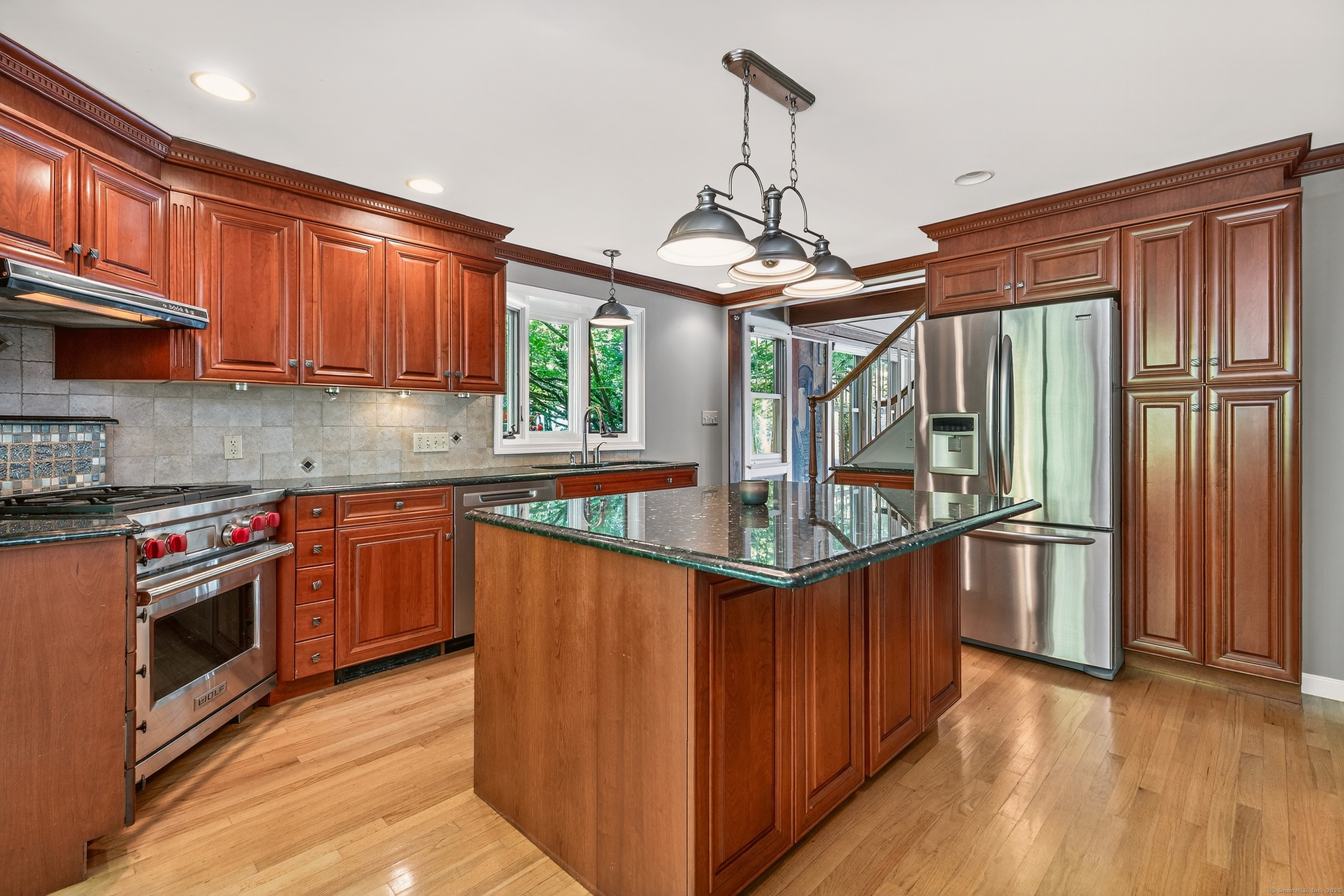 98 Island Trail Morris, CT 06763 - Photo 21 of 36 a kitchen with stainless steel appliances granite countertop a stove and a refrigerator
