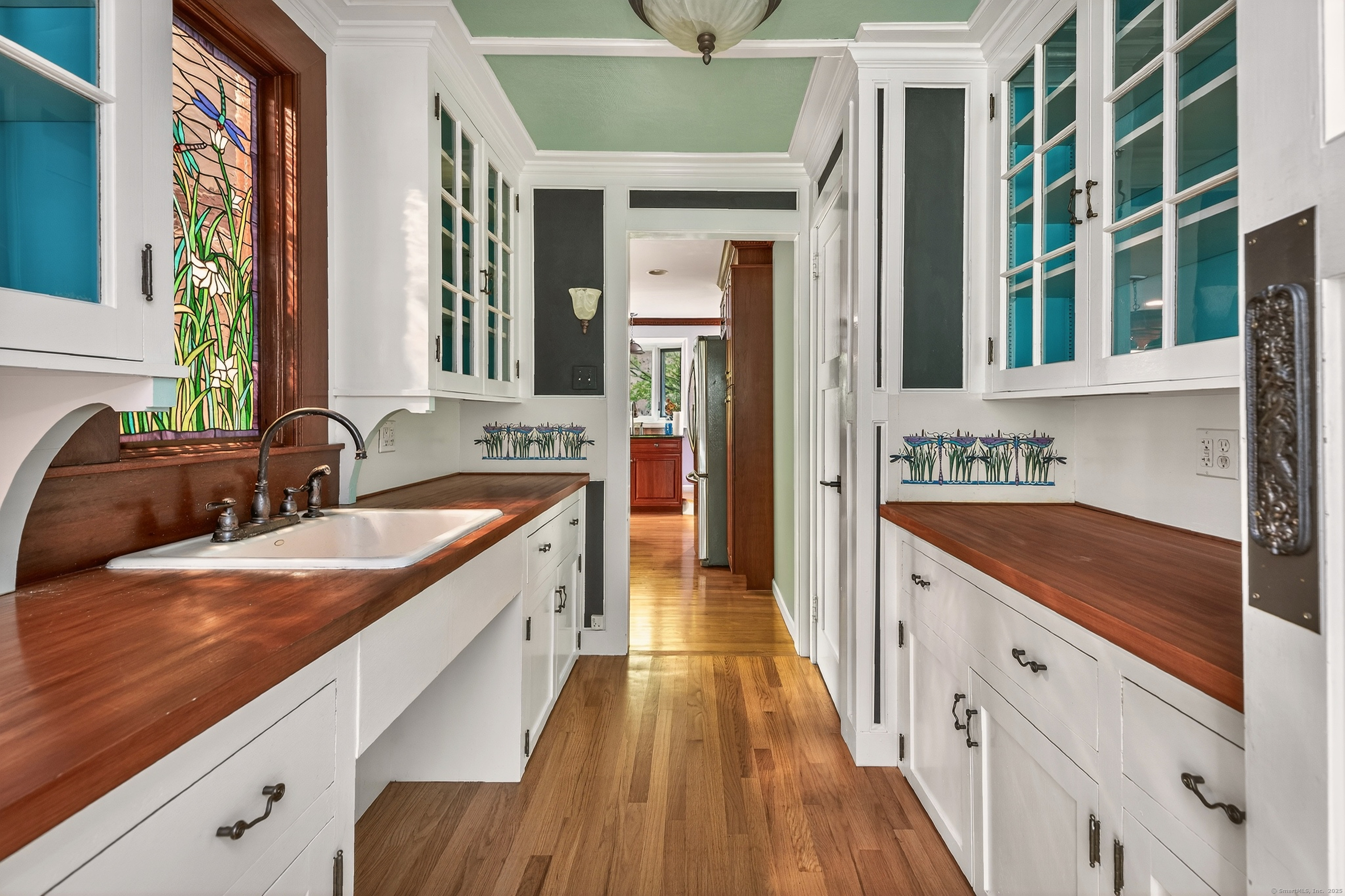 98 Island Trail Morris, CT 06763 - Photo 22 of 36 a large kitchen with a sink and a stove top oven with wooden floor