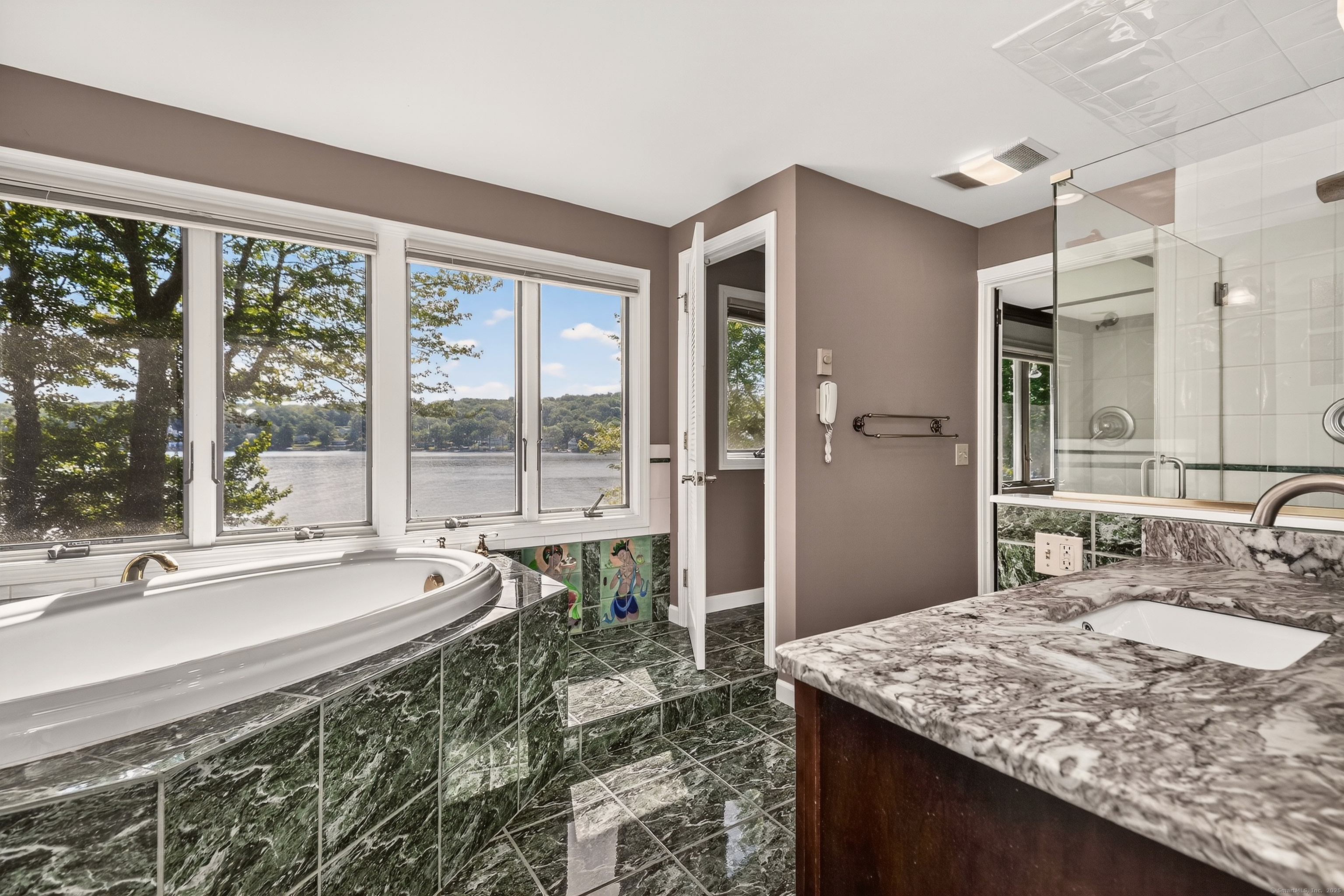 98 Island Trail Morris, CT 06763 - Photo 27 of 36 a bathroom with a granite countertop sink and a large mirror