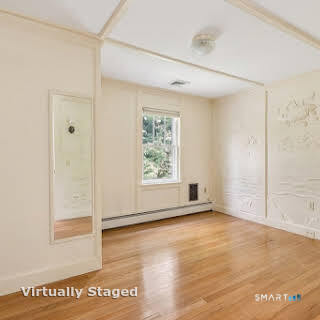 98 Island Trail Morris, CT 06763 - Photo 31 of 36 a view of an empty room with window and wooden floor