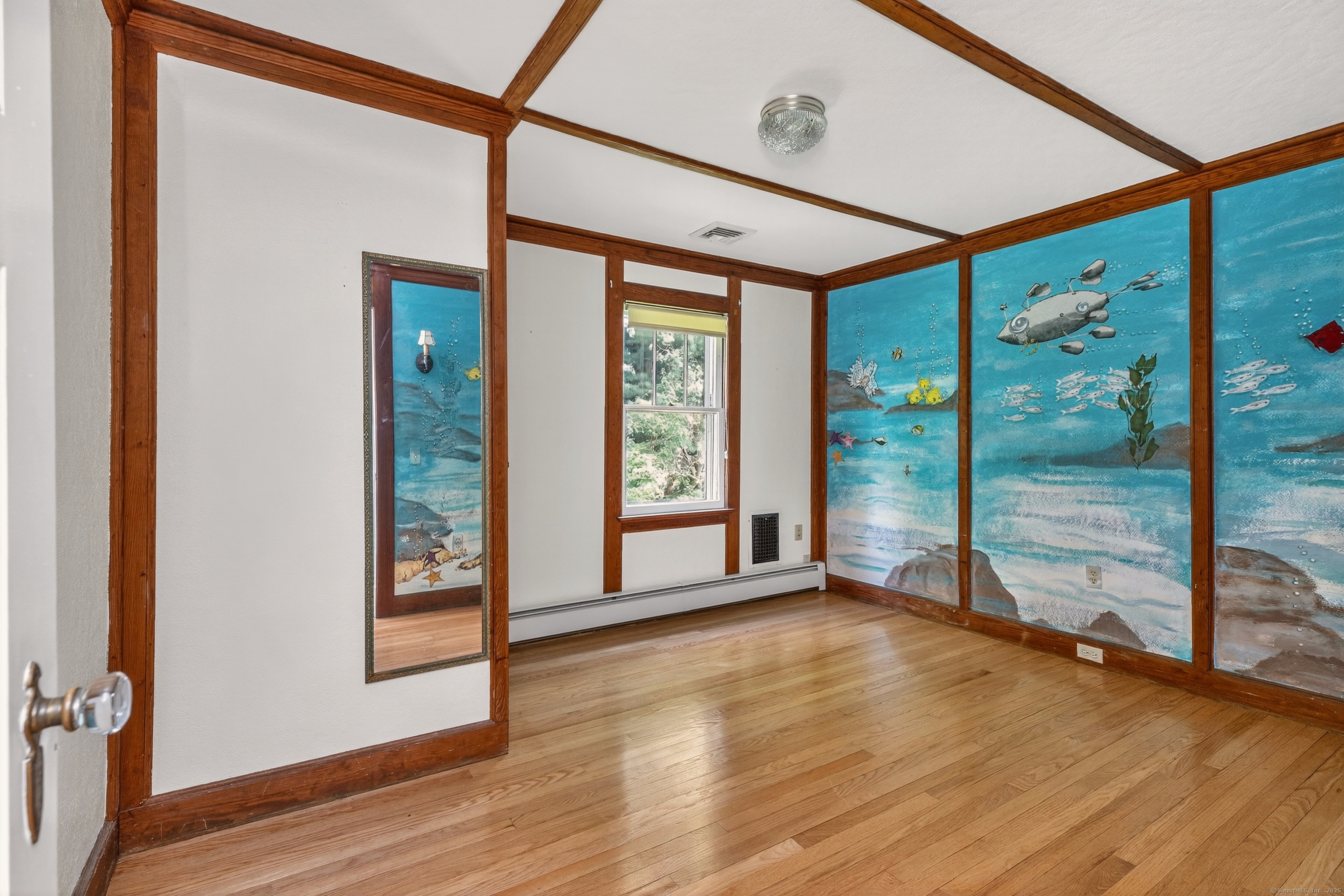 98 Island Trail Morris, CT 06763 - Photo 32 of 36 a view of an empty room with wooden floor and a window