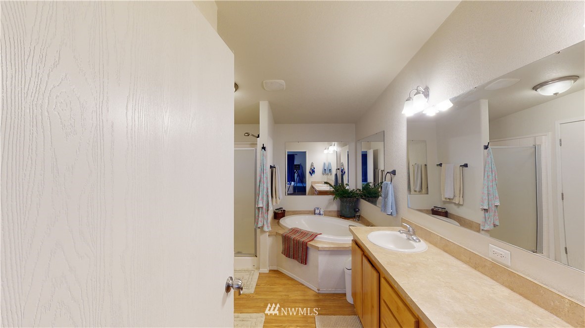 196 Skyrocket Road Prescott, WA 99348 - Photo 14 of 21 a bathroom with a granite countertop sink mirror vanity and toilet