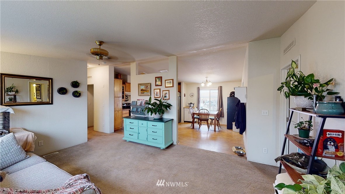 196 Skyrocket Road Prescott, WA 99348 - Photo 3 of 21 a living room with furniture and a flat screen tv