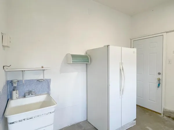 a bathroom with a tub a sink and a shower