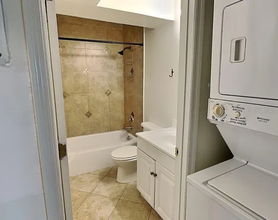 a bathroom with a toilet a sink and bathtub