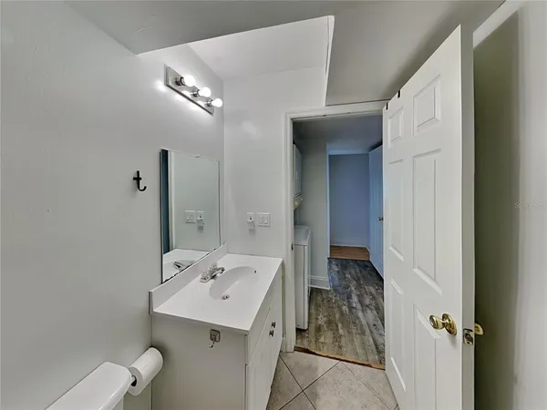 a bathroom with a sink and mirror