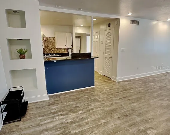 a view of a kitchen cabinets and a kitchen counter space