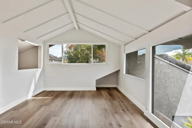 a view of a chairs and table in a patio