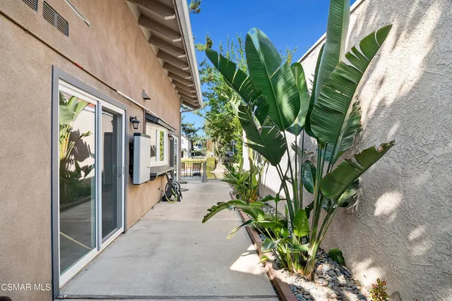 a view of swimming pool with outdoor seating and lake view