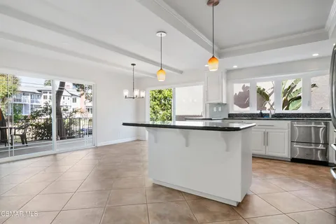 a view of an empty room with windows