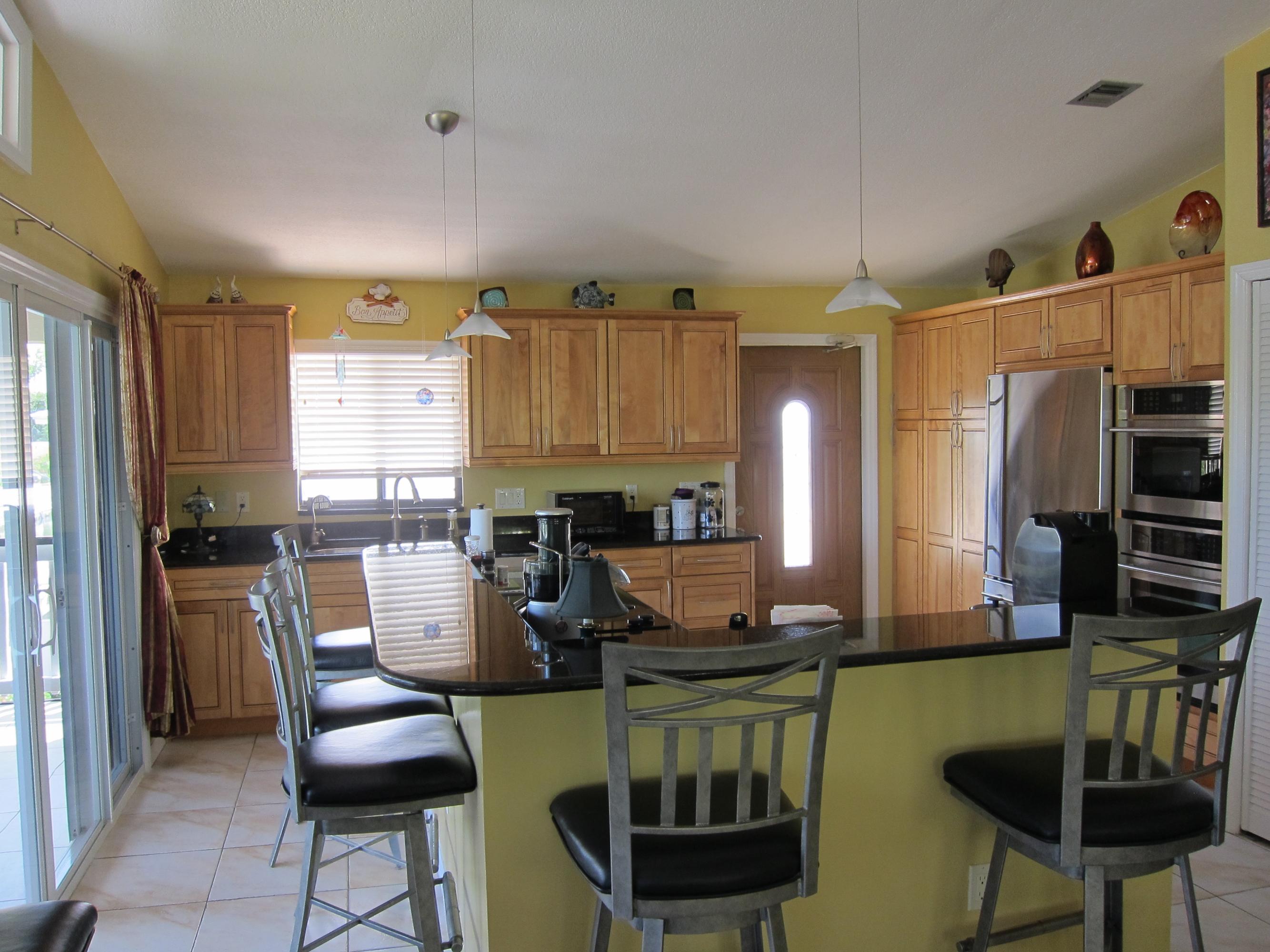 29527 Ranger Avenue Big Pine Key, FL 33043 - Photo 12 of 27 Granite with beautifu wood cabinets