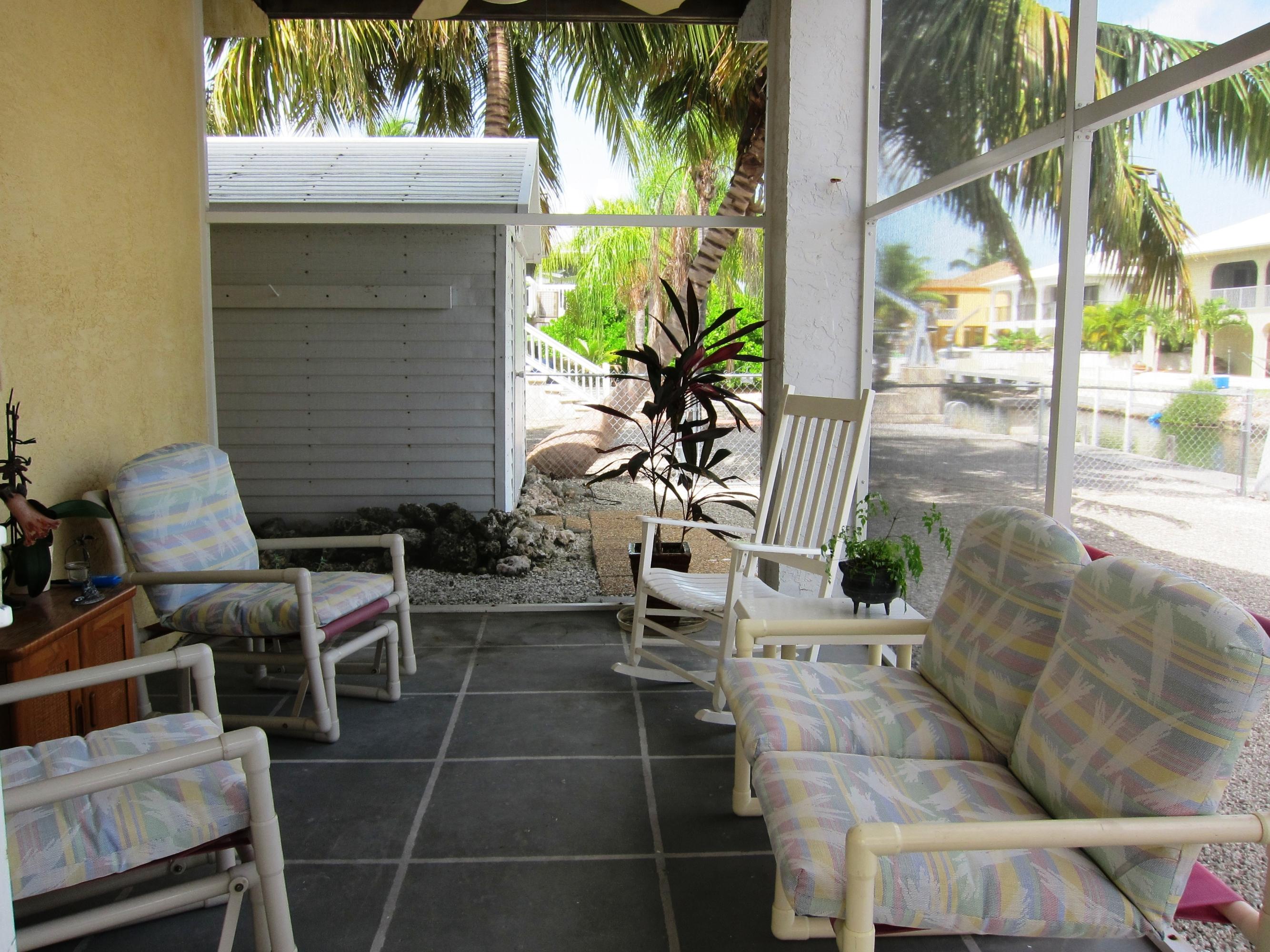 29527 Ranger Avenue Big Pine Key, FL 33043 - Photo 4 of 27 Downstairs Screened Patio