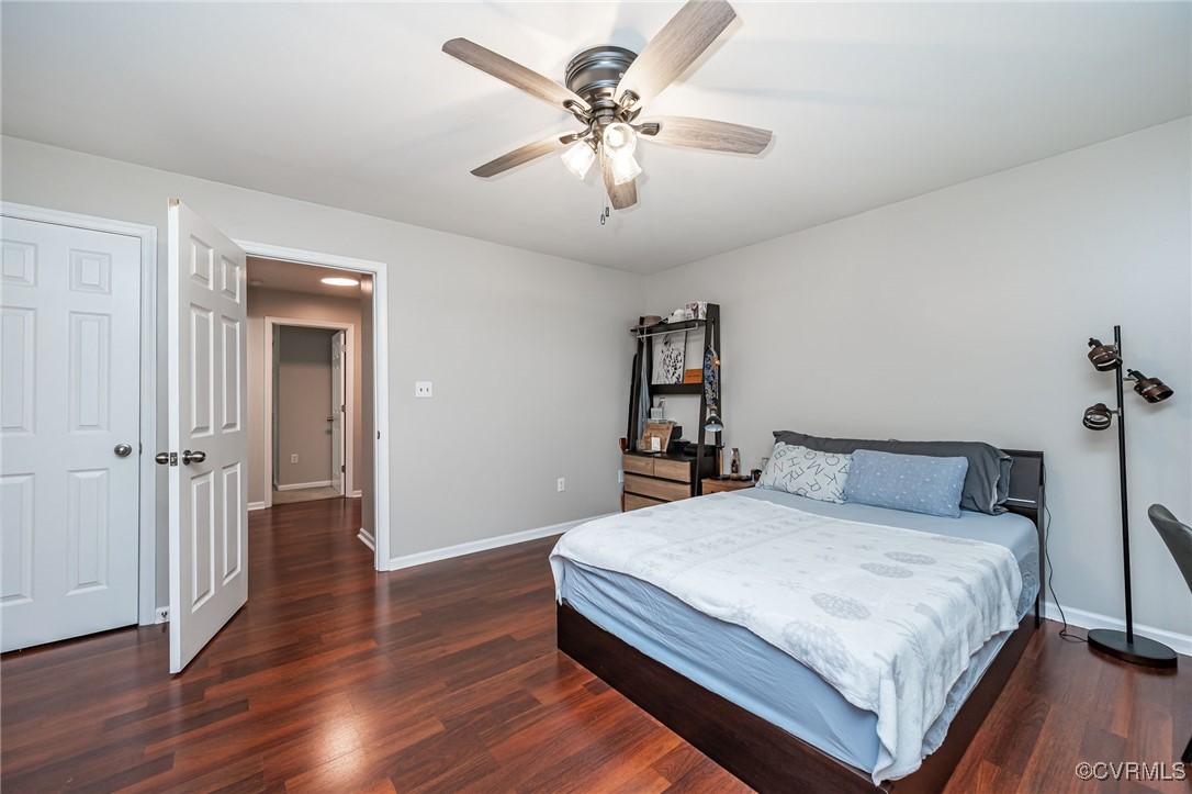 7427 Trailing Rock Road Prince George, VA 23875 - Photo 11 of 25 a bedroom with a bed and a chandelier