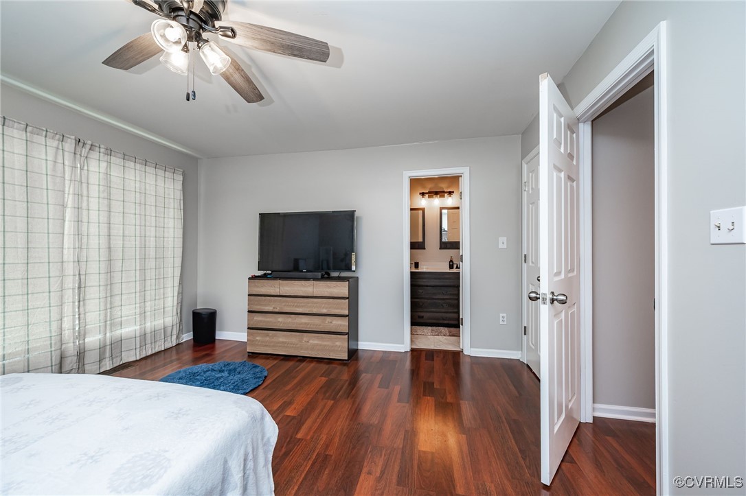 7427 Trailing Rock Road Prince George, VA 23875 - Photo 12 of 25 a bedroom with a bed and a chandelier