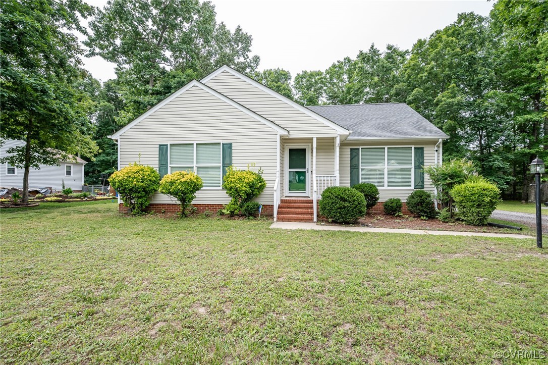 7427 Trailing Rock Road Prince George, VA 23875 - Photo 20 of 25 a view of a house with backyard and garden