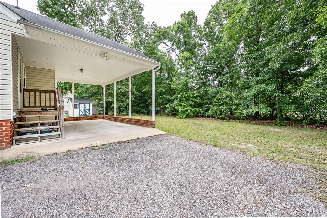7427 Trailing Rock Road Prince George, VA 23875 - Photo 23 of 25 a view of a house with backyard and porch