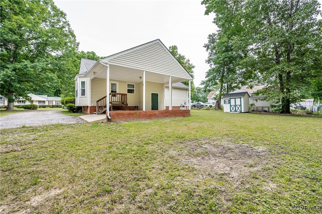 7427 Trailing Rock Road Prince George, VA 23875 - Photo 24 of 25 a view of a house with a yard and sitting area