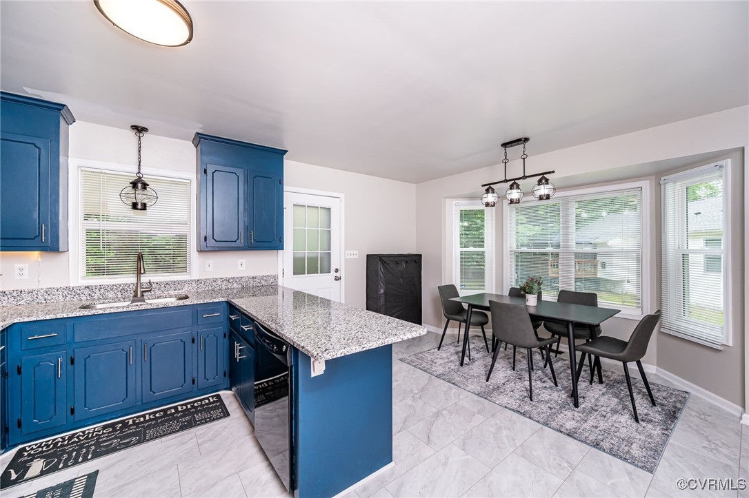 7427 Trailing Rock Road Prince George, VA 23875 - Photo 3 of 25 a dining hall with granite countertop a sink dishwasher white cabinets couches and chairs with wooden floor