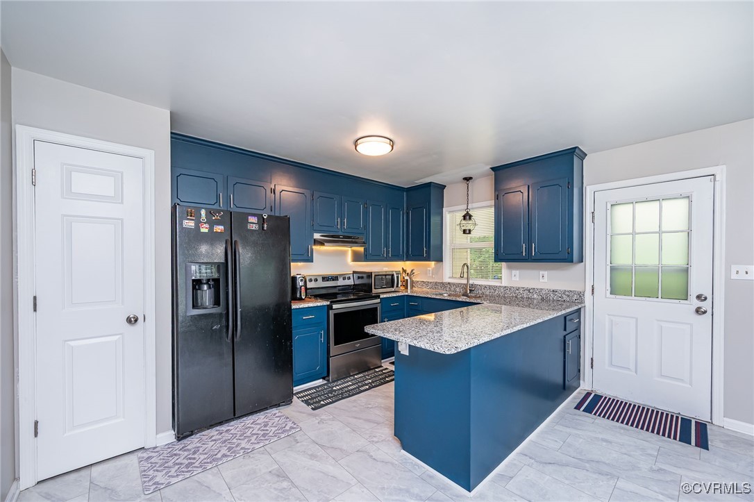 7427 Trailing Rock Road Prince George, VA 23875 - Photo 4 of 25 a kitchen with stainless steel appliances granite countertop a refrigerator a stove and a sink with wooden cabinets