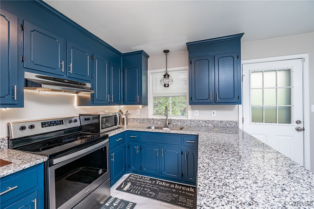 7427 Trailing Rock Road Prince George, VA 23875 - Photo 5 of 25 a kitchen with granite countertop a stove sink and cabinets