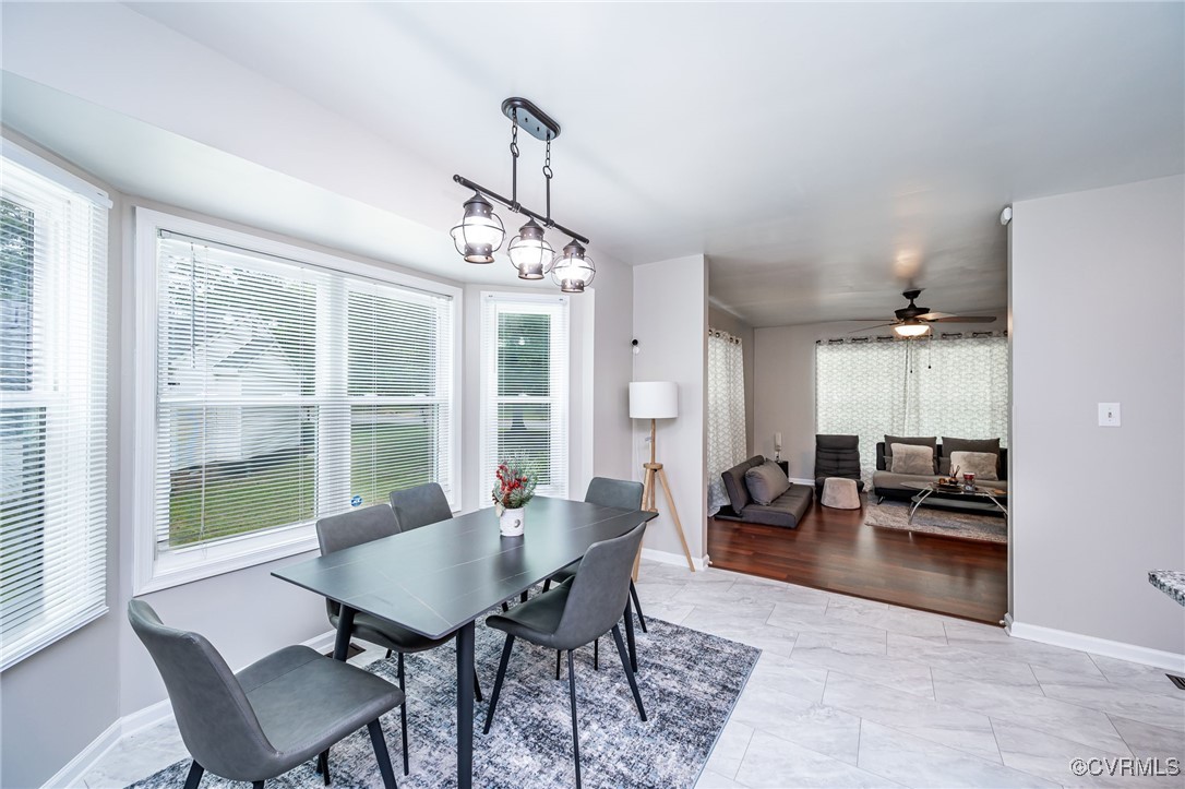 7427 Trailing Rock Road Prince George, VA 23875 - Photo 6 of 25 a view of a dining room with furniture window and outside view