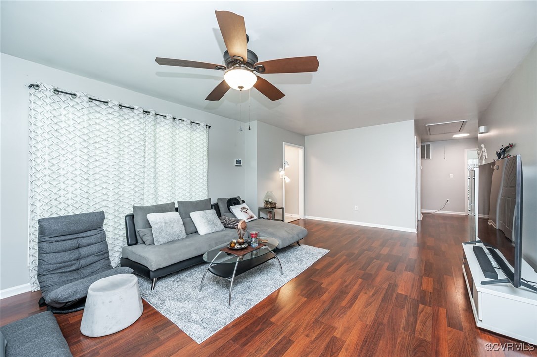 7427 Trailing Rock Road Prince George, VA 23875 - Photo 8 of 25 a living room with furniture and a flat screen tv