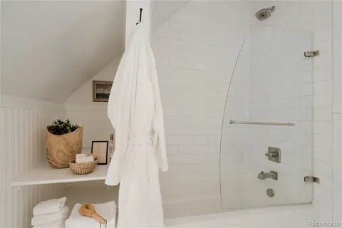 a bathroom with a bathtub and shower