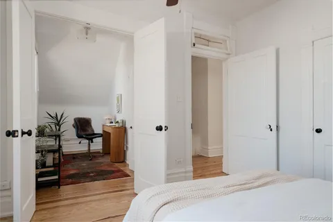 a bedroom with a bed and a table in it