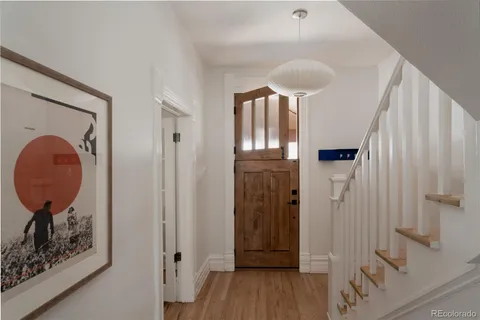 a view of entryway with bedroom and wooden floor