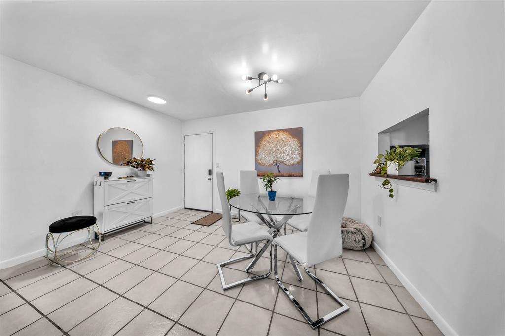 a living room with furniture and white walls