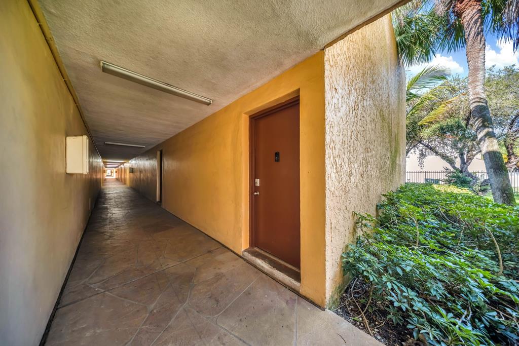 13700 Southwest 62nd Street, Unit 149 Miami, FL 33183 - Photo 13 of 16 a view of a pathway of a house