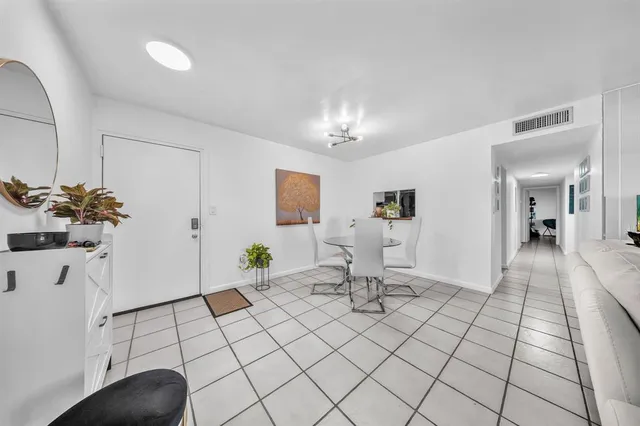a kitchen with stainless steel appliances granite countertop a sink a stove and cabinets
