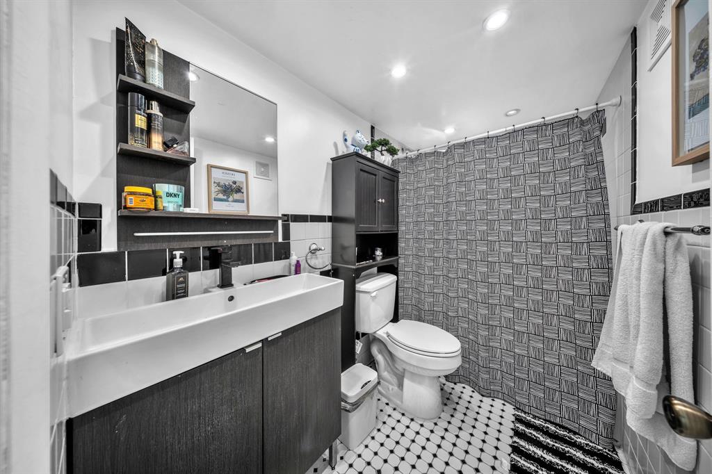 13700 Southwest 62nd Street, Unit 149 Miami, FL 33183 - Photo 7 of 16 a bathroom with a sink toilet and shower