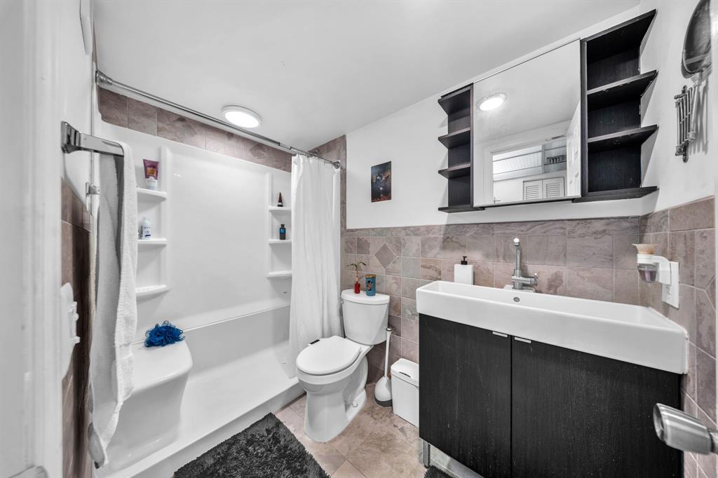 13700 Southwest 62nd Street, Unit 149 Miami, FL 33183 - Photo 9 of 16 a bathroom with a sink toilet and shower