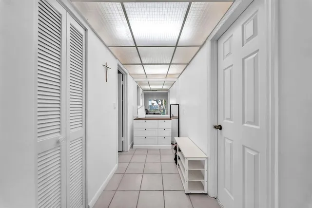 a view of walk in closet with clothes