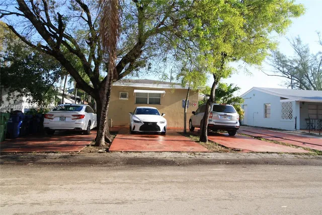 a view of a parked car in front of house